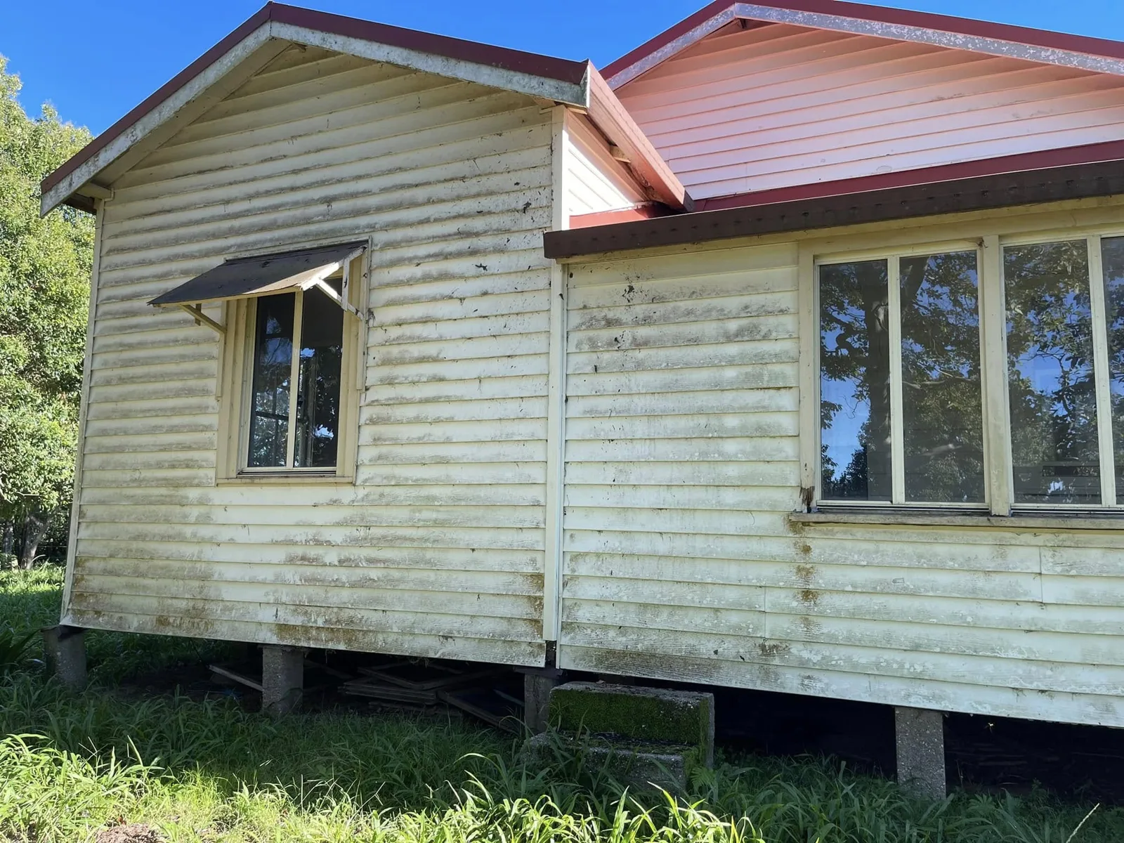 Before — weatherboard home exterior before and after house washing